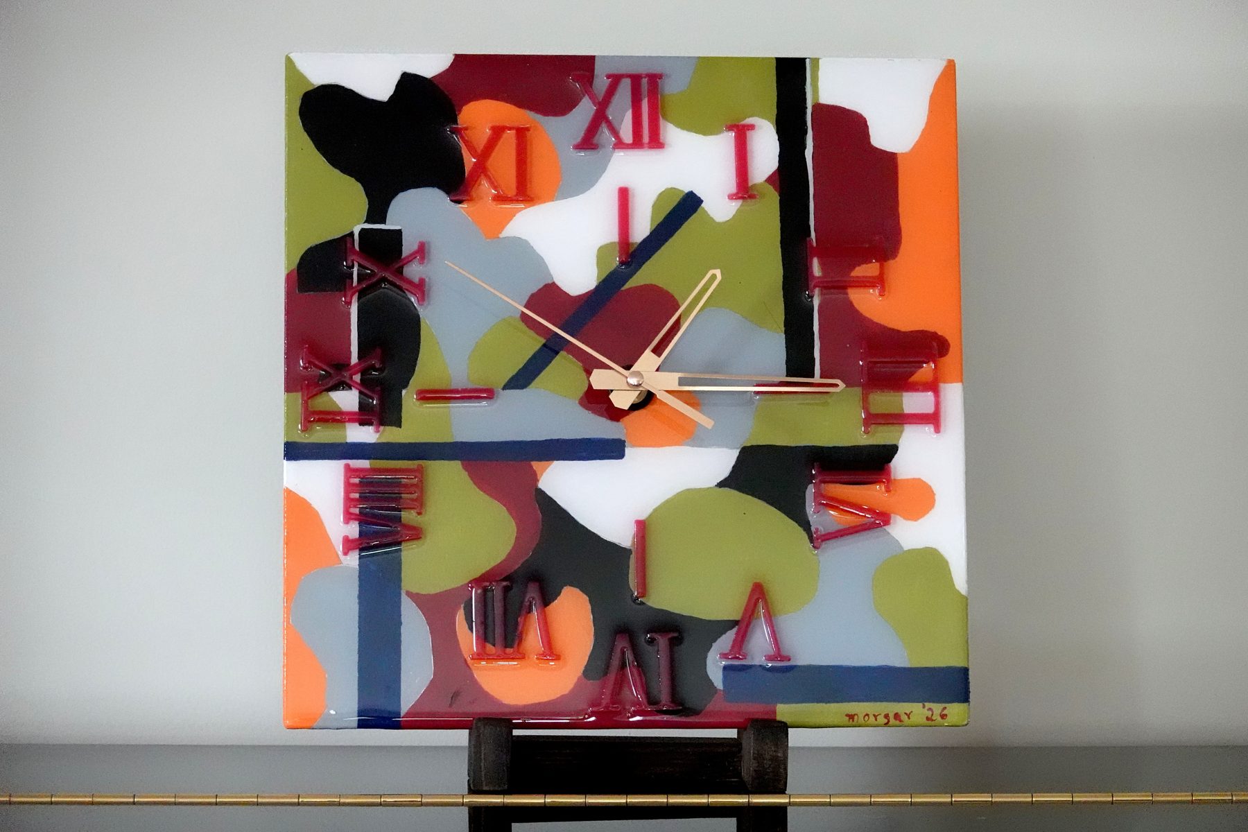 Cell Study clock, a square abstract painted resin clock with organic overlapping shapes in olive, maroon, orange and gray